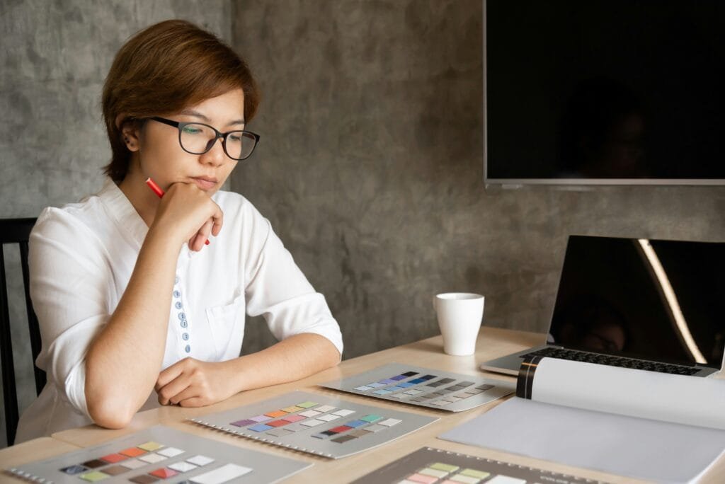 Woman looking at a sheet of paper doing calculations