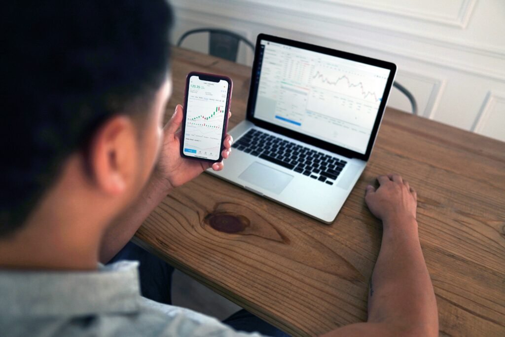 Man looking at computer screen trading 